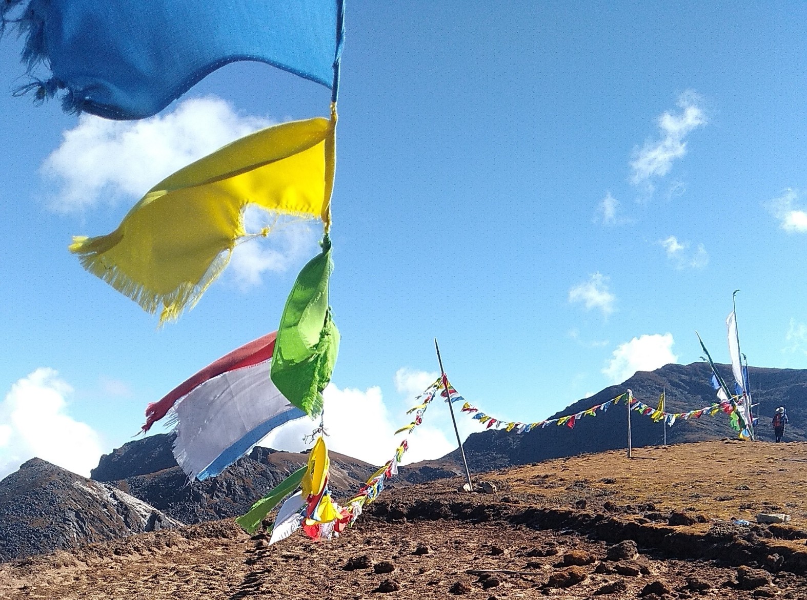Druk Path Trek - Mountain pass with prayer flags